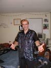 Nick with blonde hair posing for credits