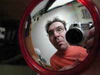 Nick taking a photo of himself in a parabolic mirror