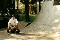 Nick sitting on his skate, on his ramp in Marblehead